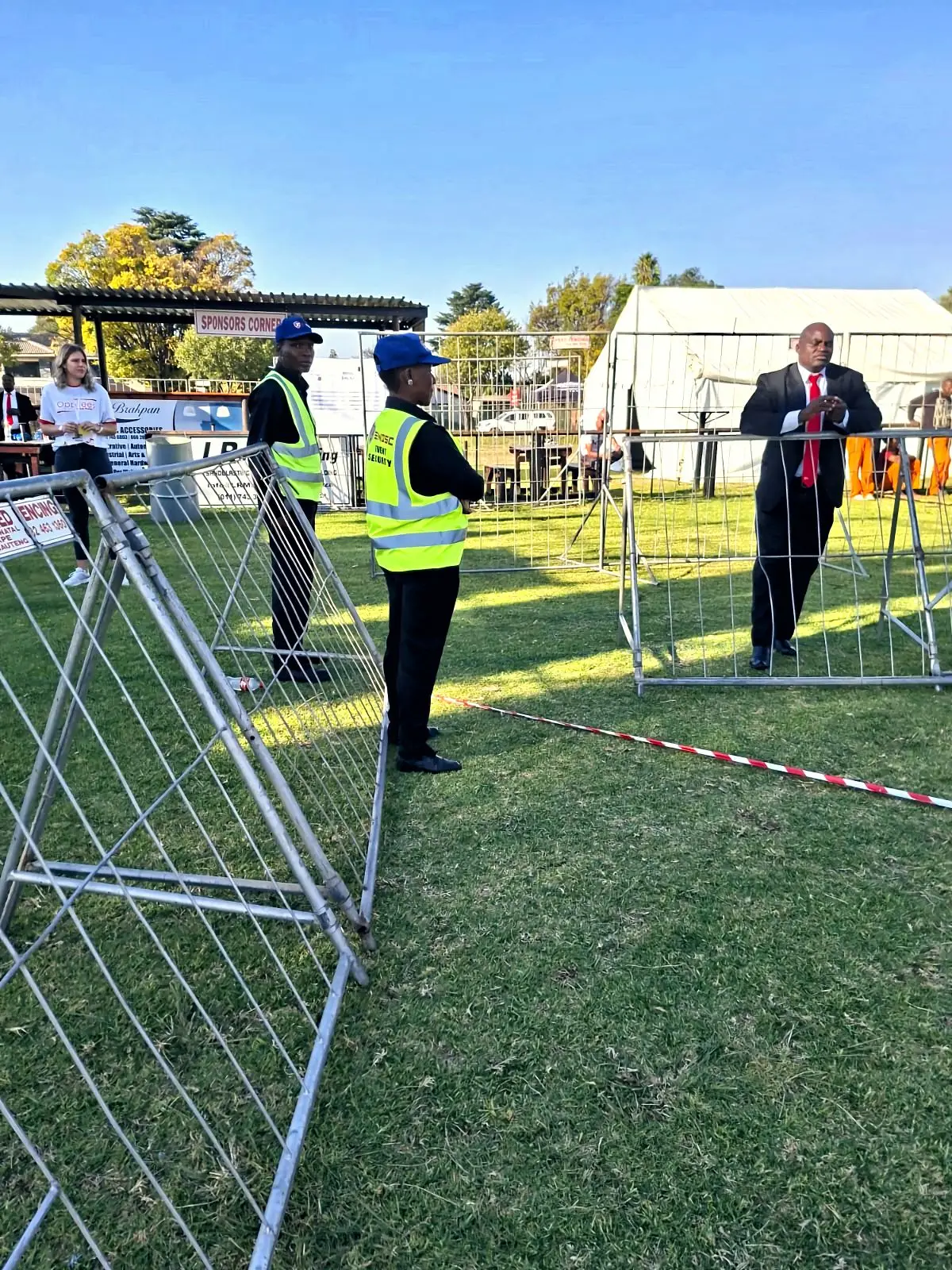 ZENOSC officers at a barrier with a suited supervisor