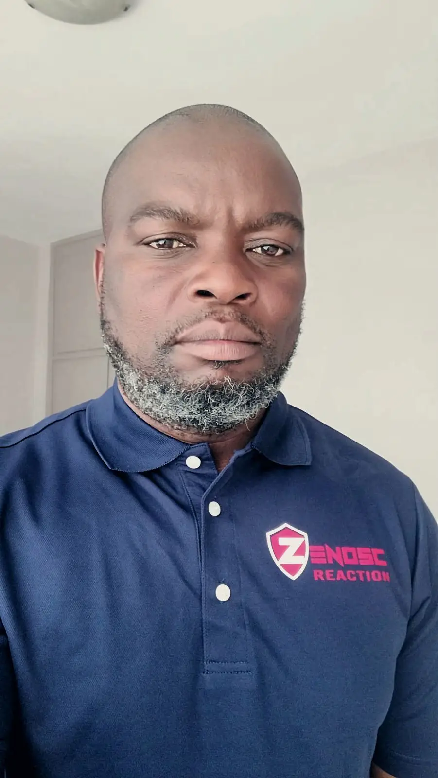 ZENOSC leader in a ZENOSC Reaction polo shirt
